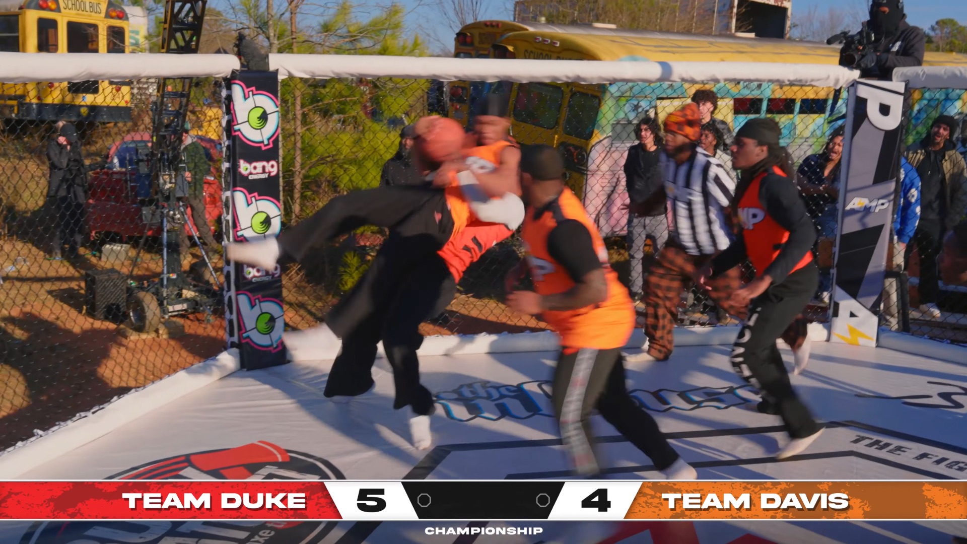 Duke Dennis body slamming Damii. (Image via @AMPEXCLUSIVE/ YouTube)