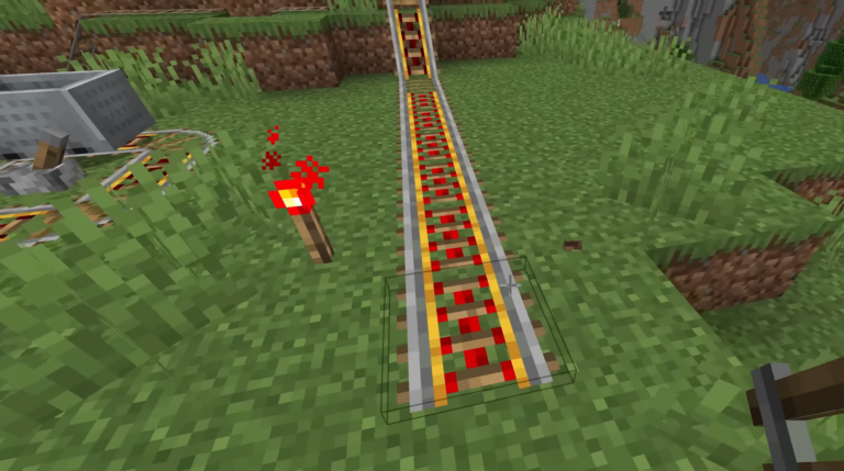 Redstone torch to power the rail