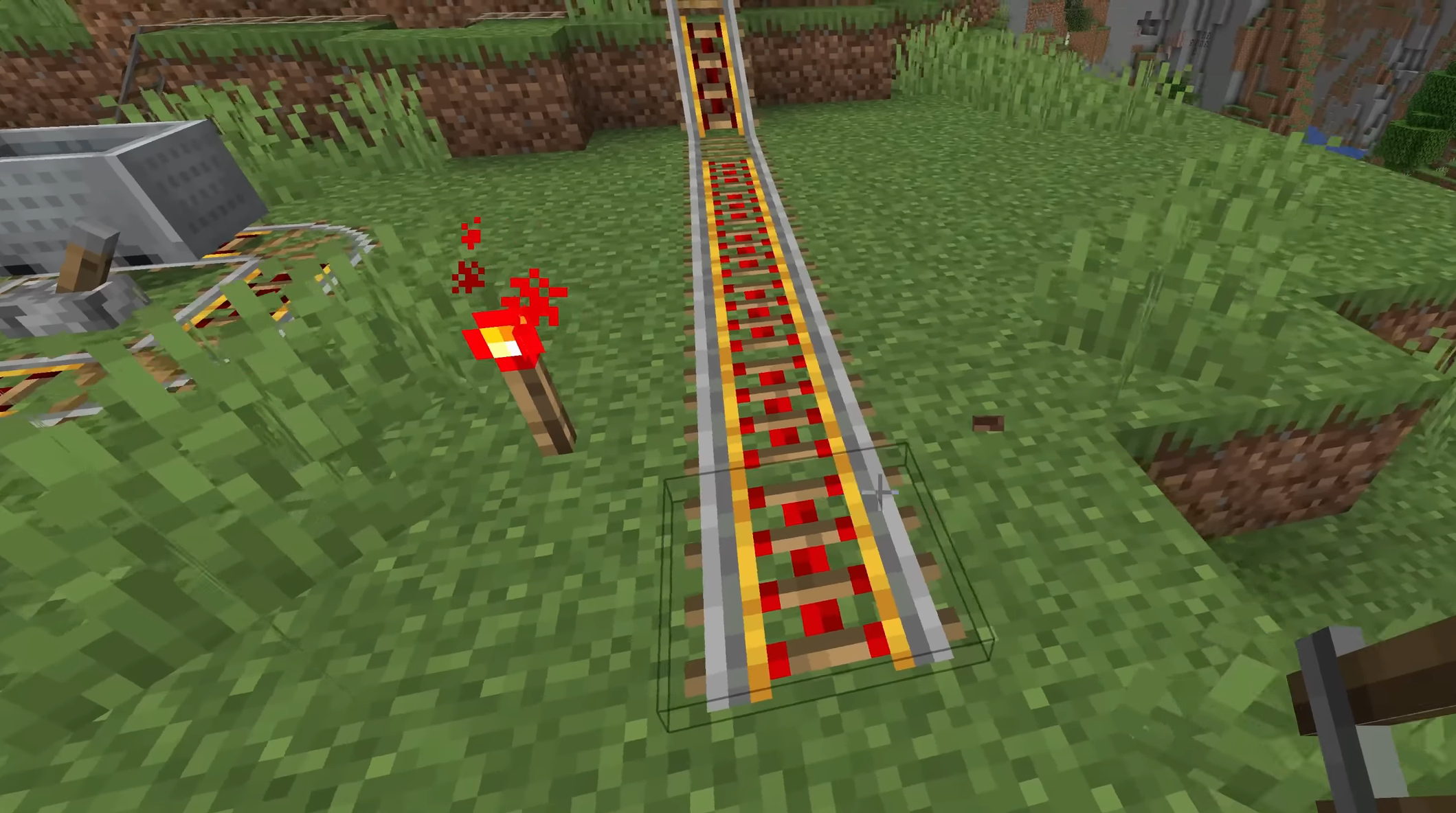 Redstone torch to power the rail