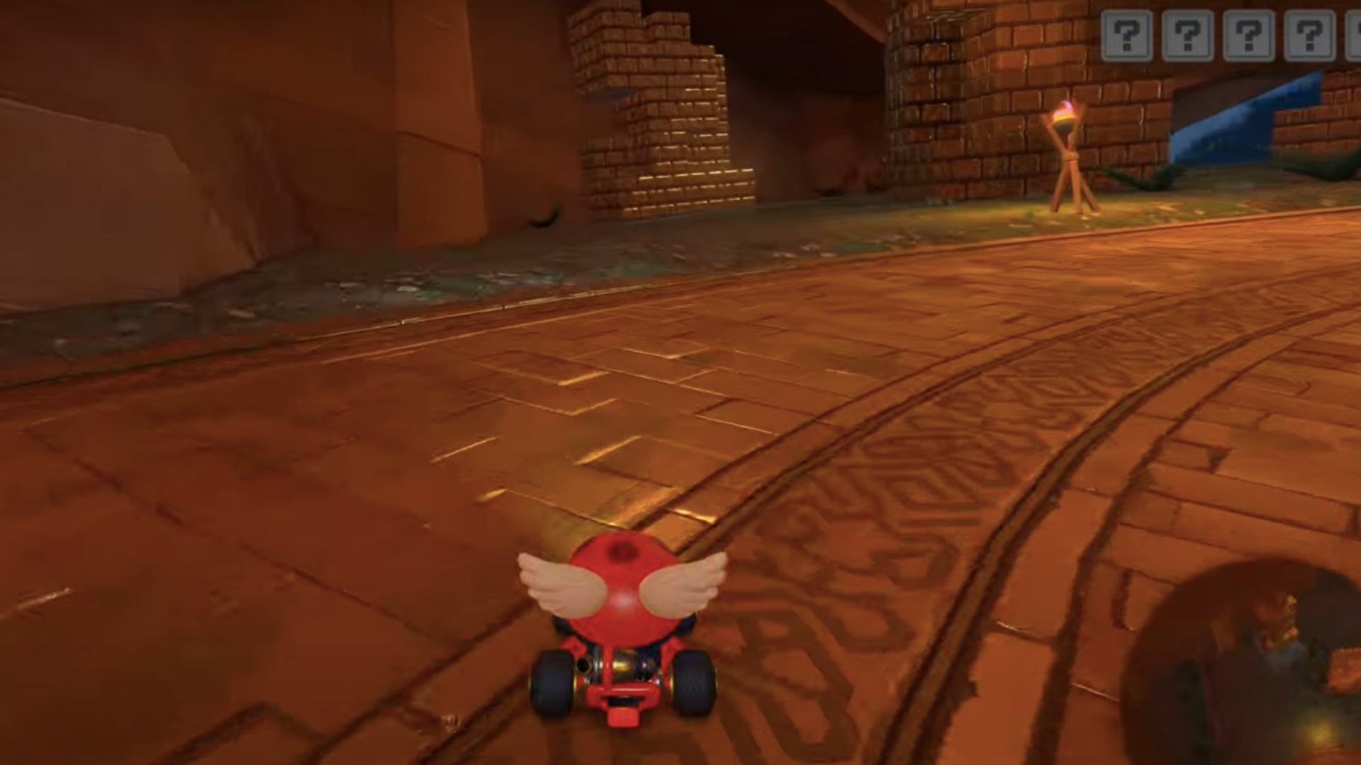 The first panel is behind these golden towers (Image via Nintendo)