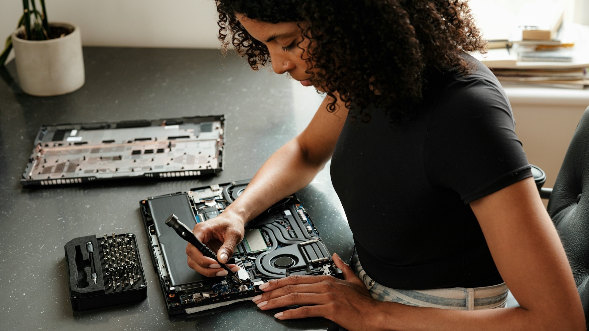 Picture describes working on a laptop's internal