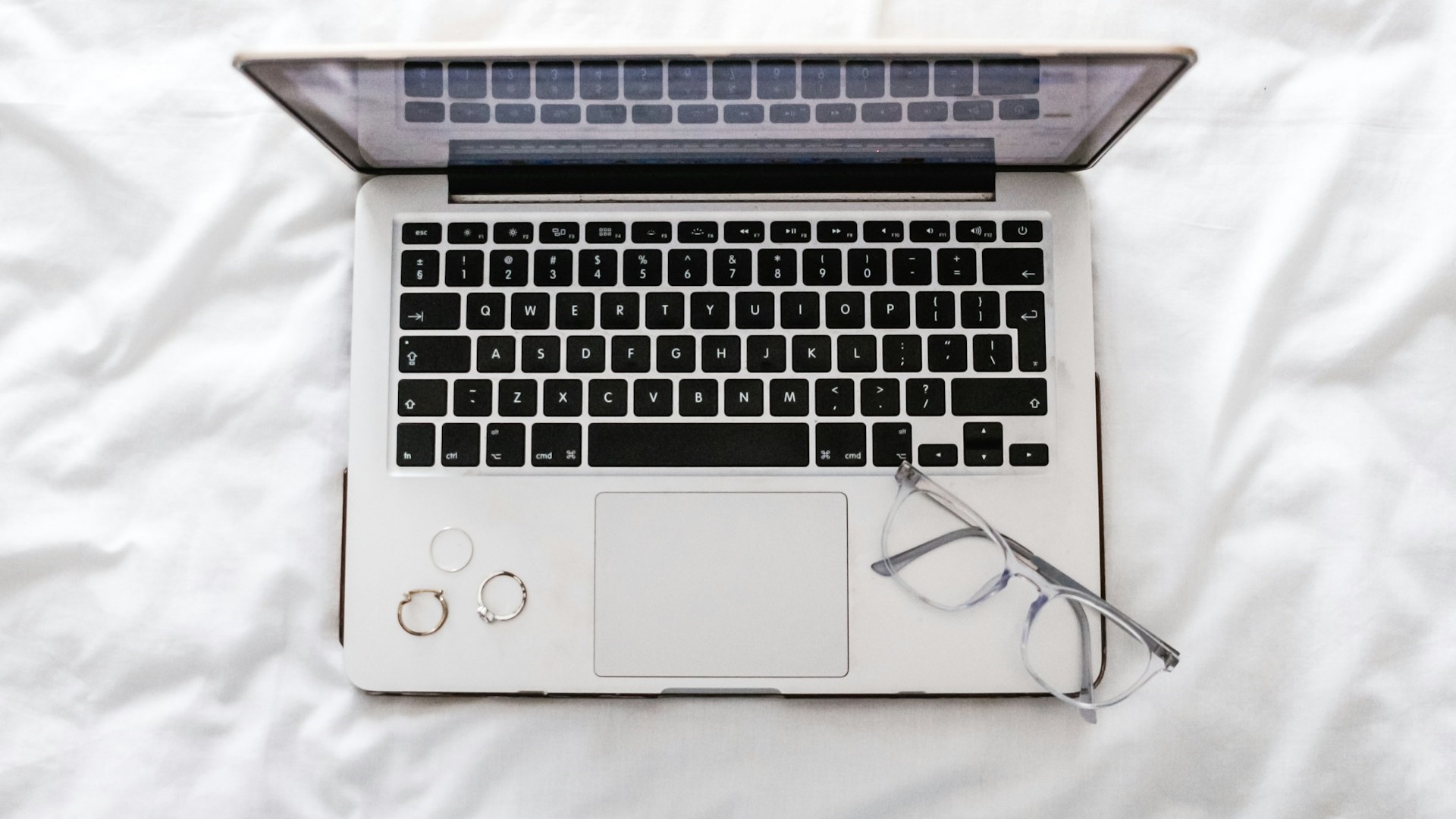 Picture describes that ssing laptops on a bed can lead to dust buildup inside the laptop