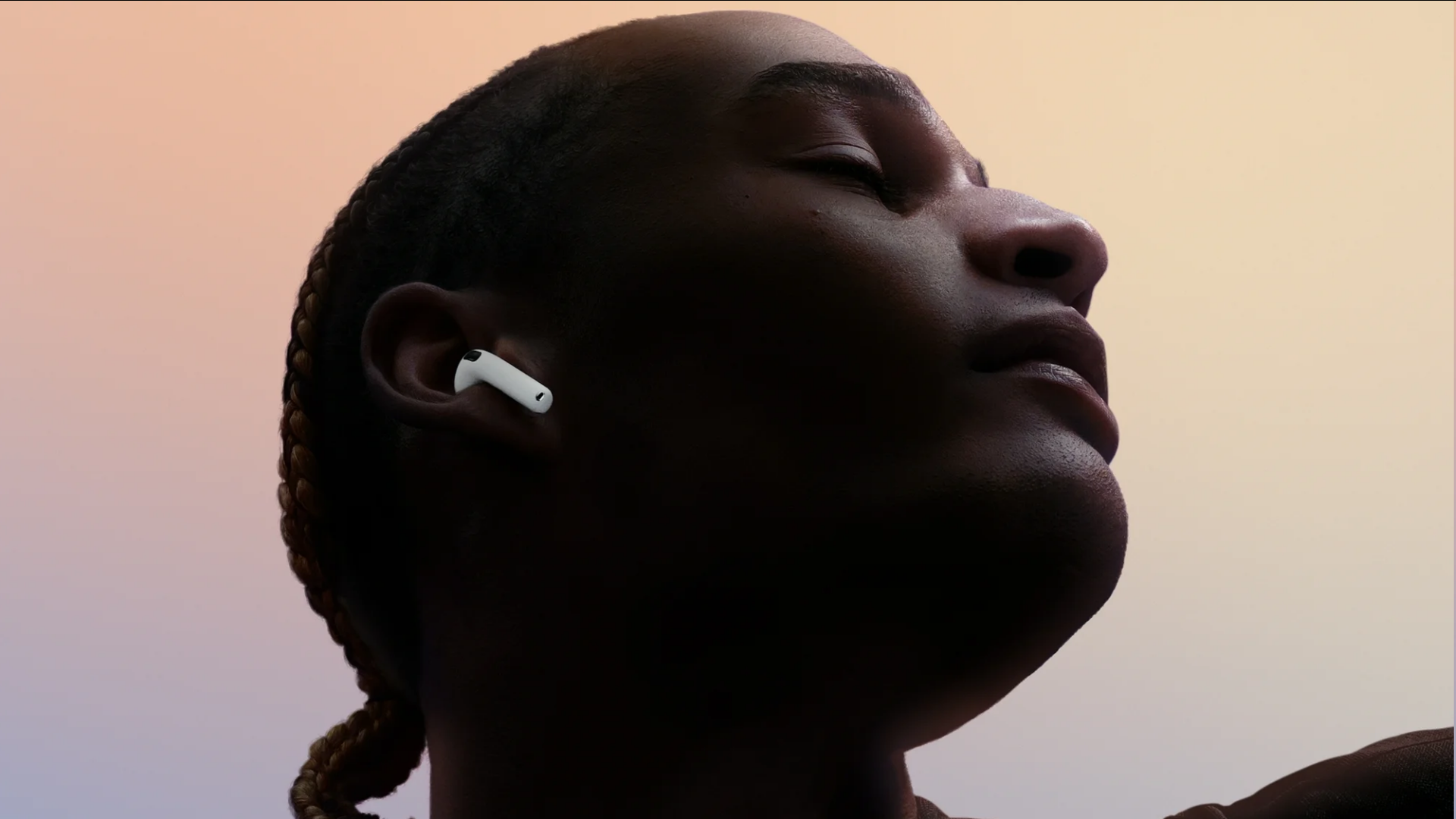 An image of a person with Apple AirPods 4 on