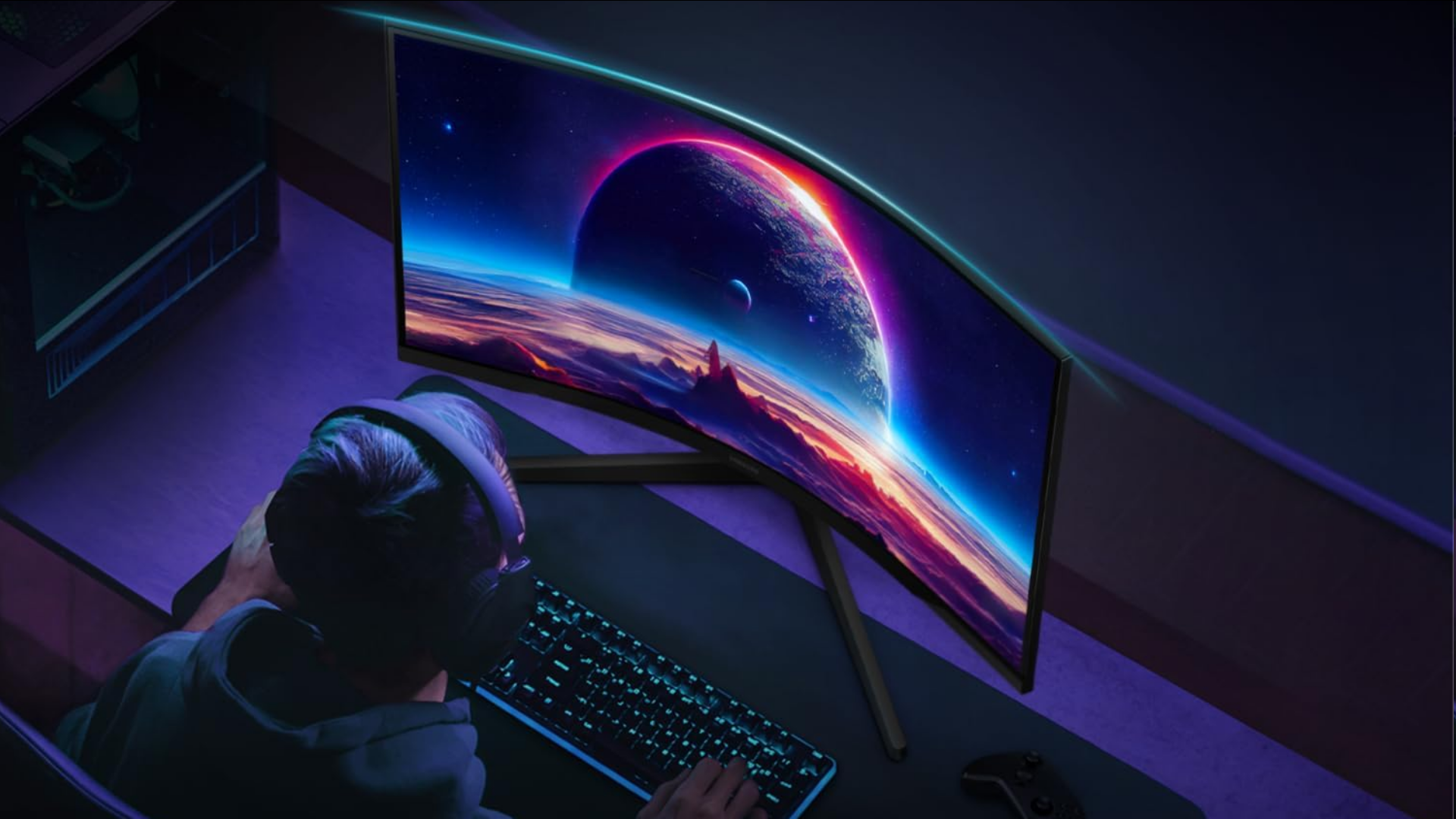 An image of a gamer on a desk, looking at the Samsung Odyssey G5 QHD monitor