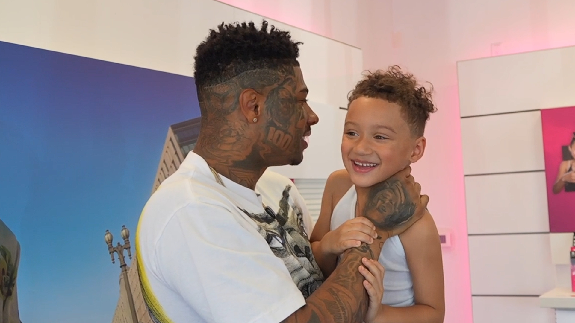 Blueface with his hands around the child's neck (Image via bluescluse124_Kick)