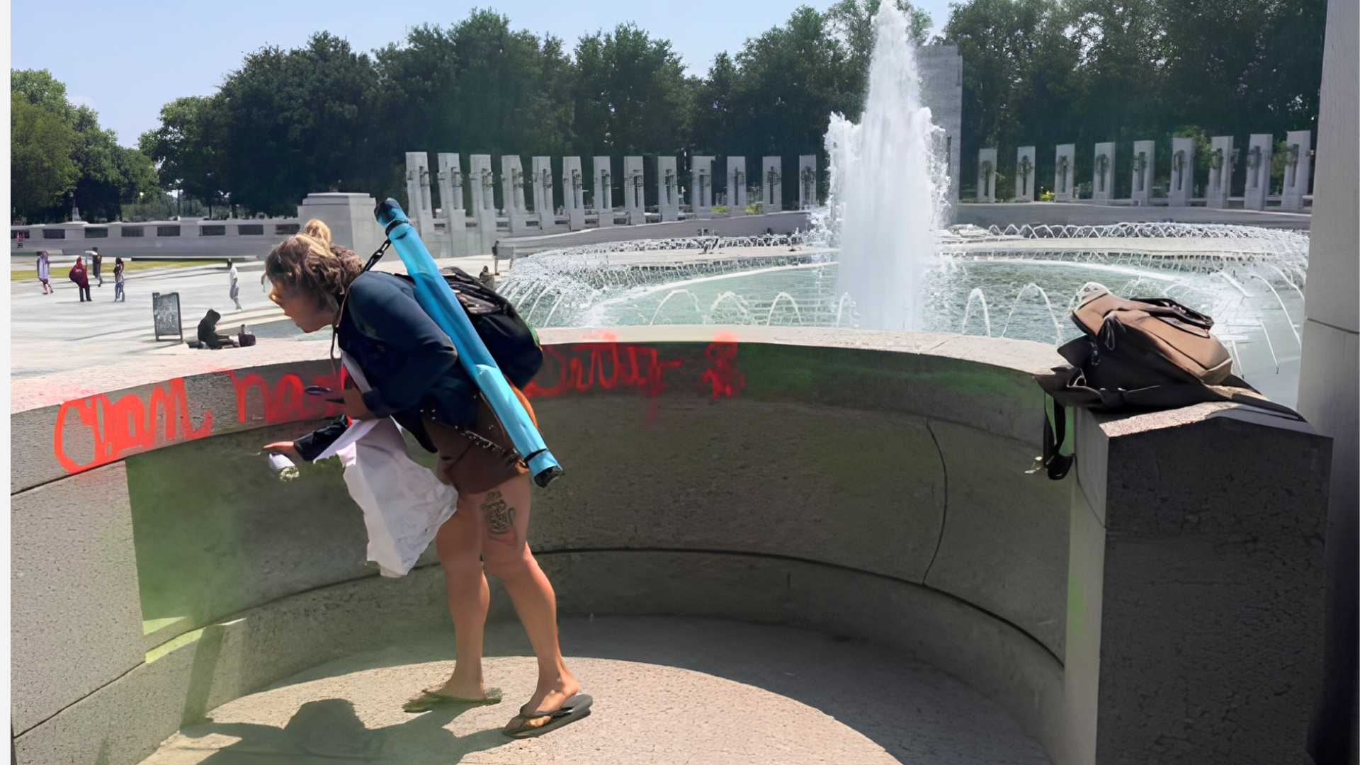 Melissa Farris vandalizing World War II Memorial (Image via Witness 1/ DOJ)