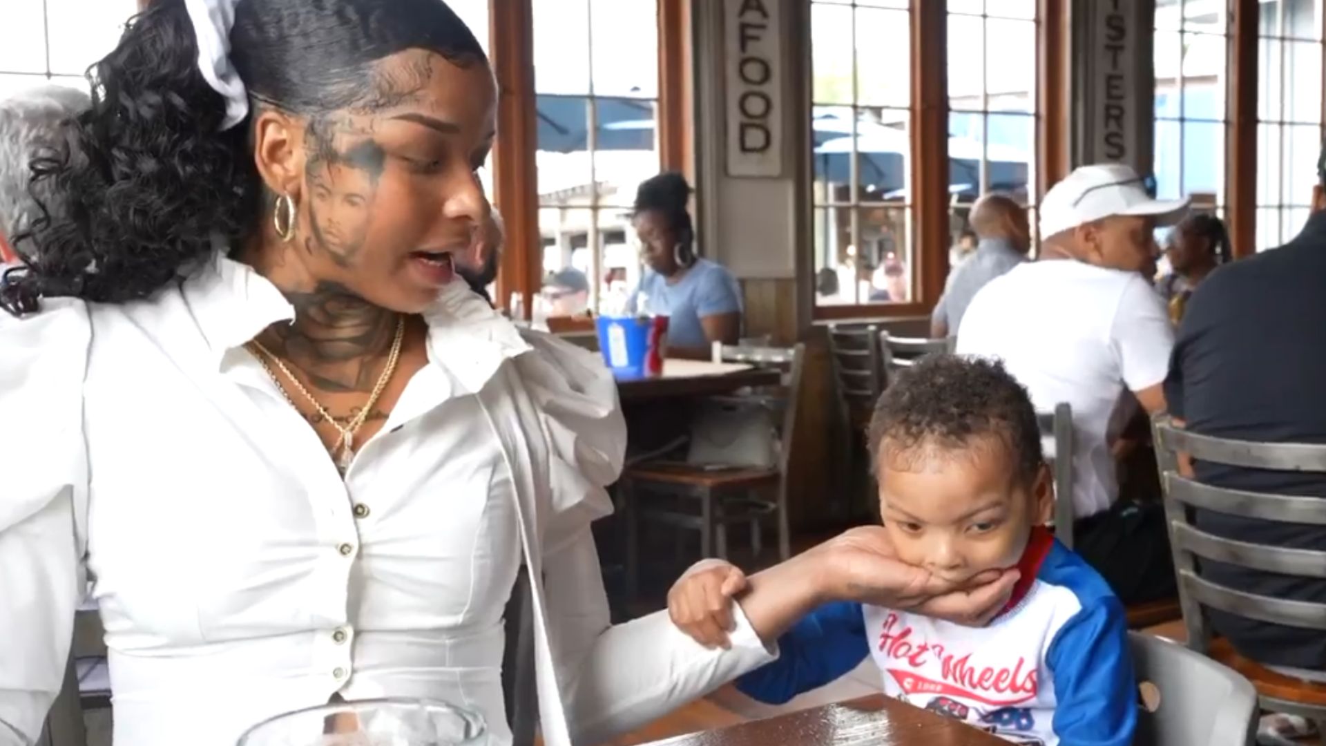 Chrisean's son was trying to bite her hand (Source: Chrisean/Kick)
