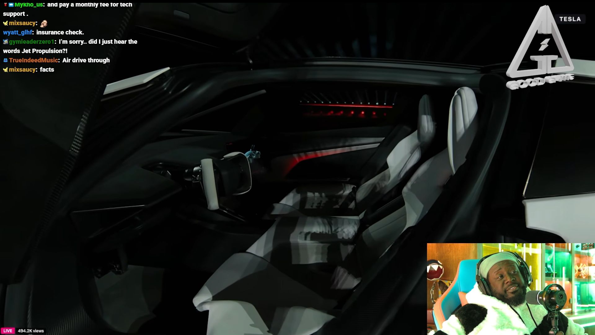 The rapper is checking out the Tesla Roadster's interior (Image via Twitch/TPAIN)